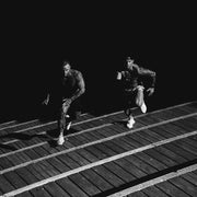 2 men running